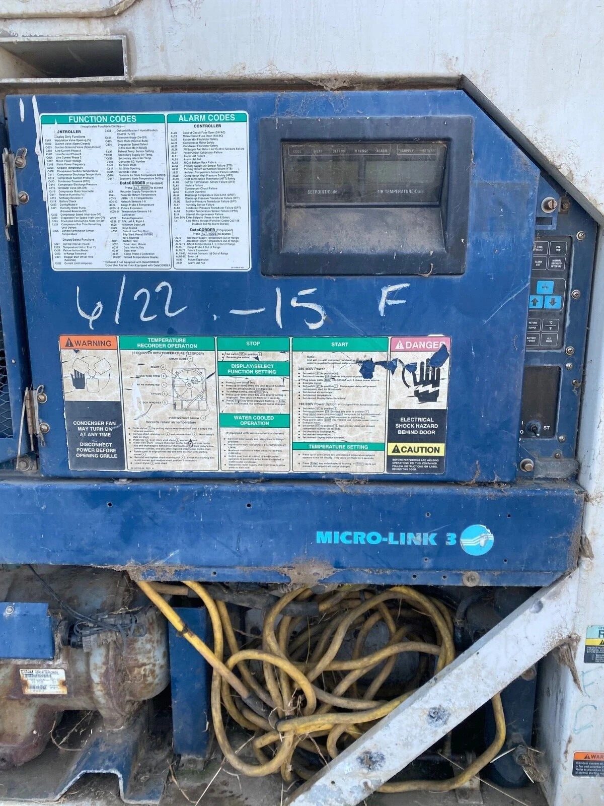 40ft Used Refrigerated Shipping Container – Custom Side Door – weathered refrigeration control panel with exposed cables and machinery