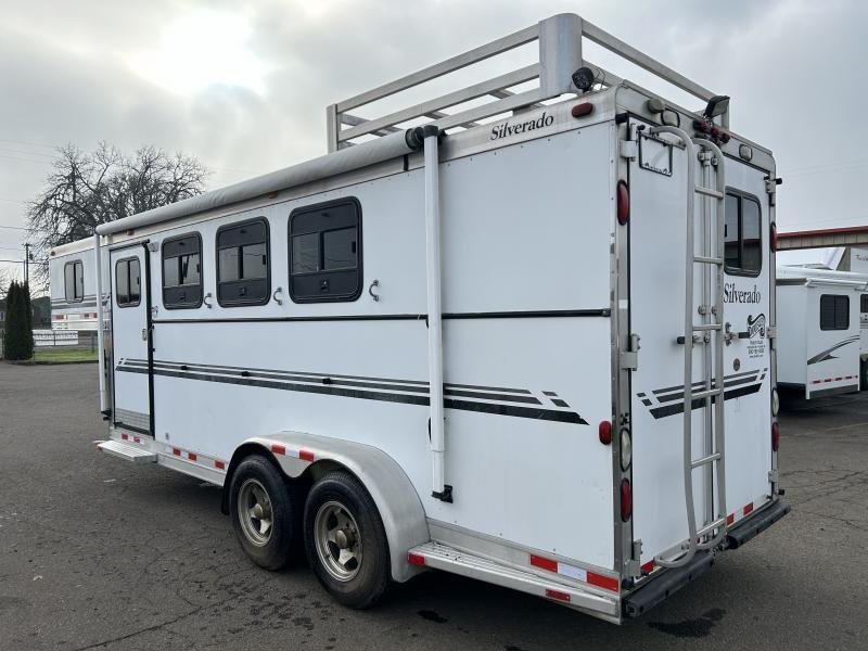2002 Silverado 3 Horse Gooseneck Trailer – Wood Interior – Rear three-quarter view of the trailer showing the ladder and roof rack