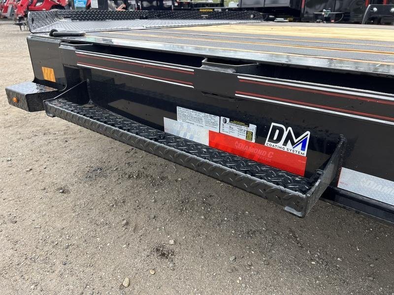 2024 Diamond C 24 ft Tilt Trailer – Spare Mount – Close-up of the trailer side step and manufacturer coating system decals