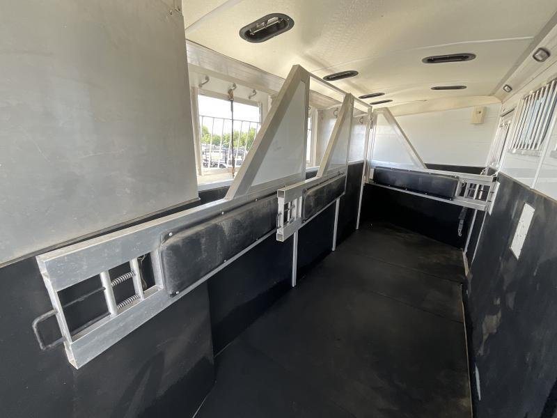 2005 Jamco 4 Horse Gooseneck Trailer – Blue, Air Suspension – Stall dividers shown in the open position inside the trailer
