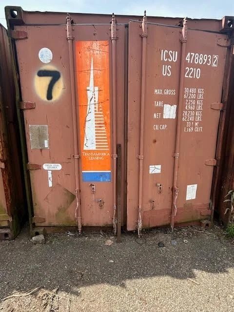 20ft Used Shipping Container – Double Cargo Doors – closed cargo doors on a weathered shipping container
