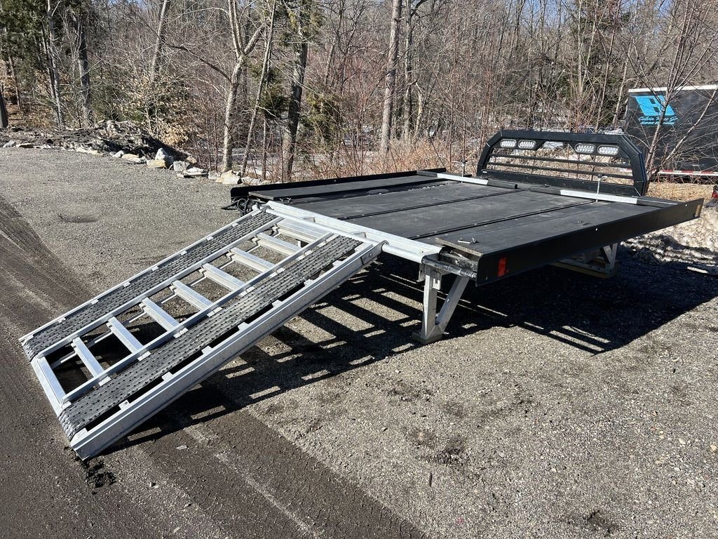 2023 Sno Pro 8 ft Sled Deck – Sliding Sides – Three-quarter view from the rear showing the ramp and deck together
