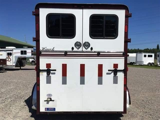 2007 Hawk 2 Horse Bumper Pull Trailer – Side Ramp – The rear view of the horse trailer showing closed doors and red reflective tape