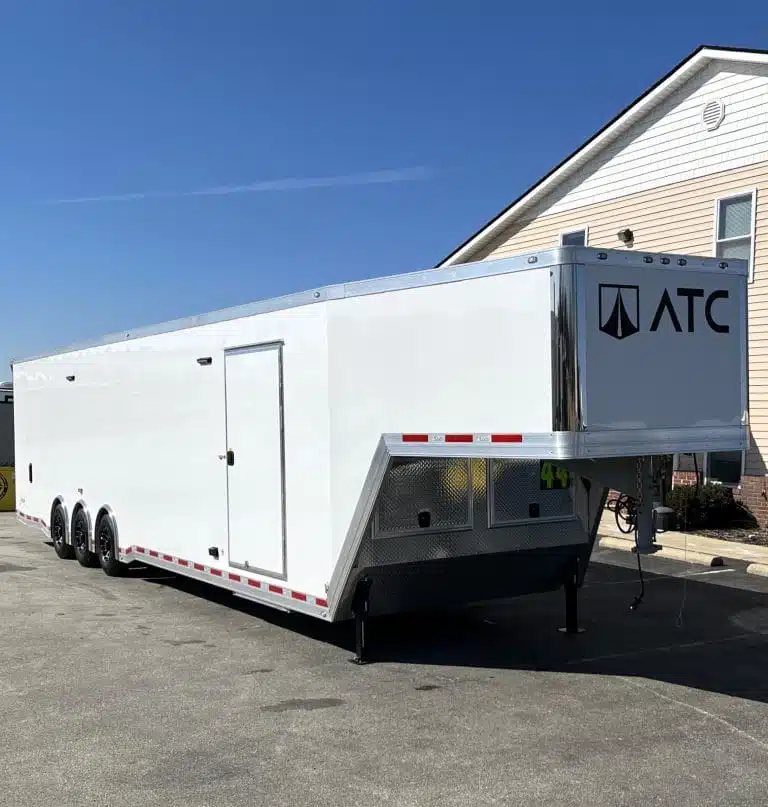 2026 ATC 44 ft Car Trailer – Aluminum Wheels – Front three-quarter view of a white gooseneck trailer with black wheels