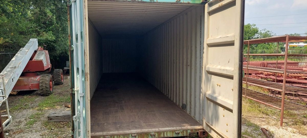 40ft Used Shipping Container – Wind & Watertight Storage – empty container interior through open cargo doors in equipment yard