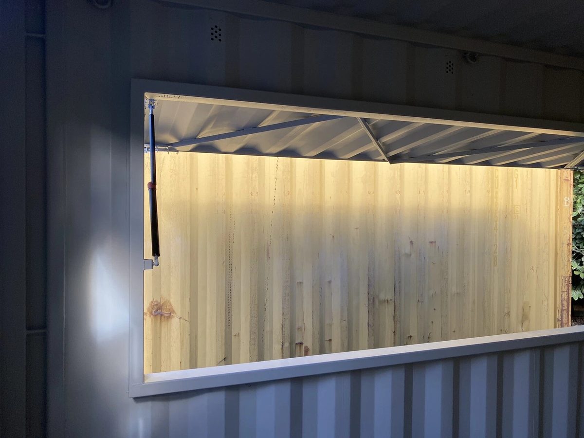 15ft Custom Container Bar & Kiosk – Side Service Hatches – Interior view of raised service hatch and support strut