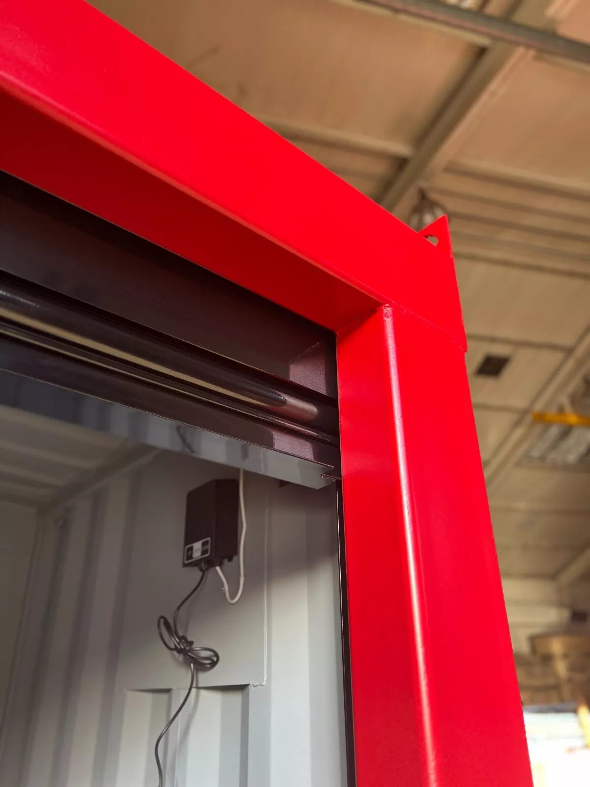 6ft Bespoke Storage Container – Motorized Roller Shutter – close-up of red doorway frame and roller shutter mechanism