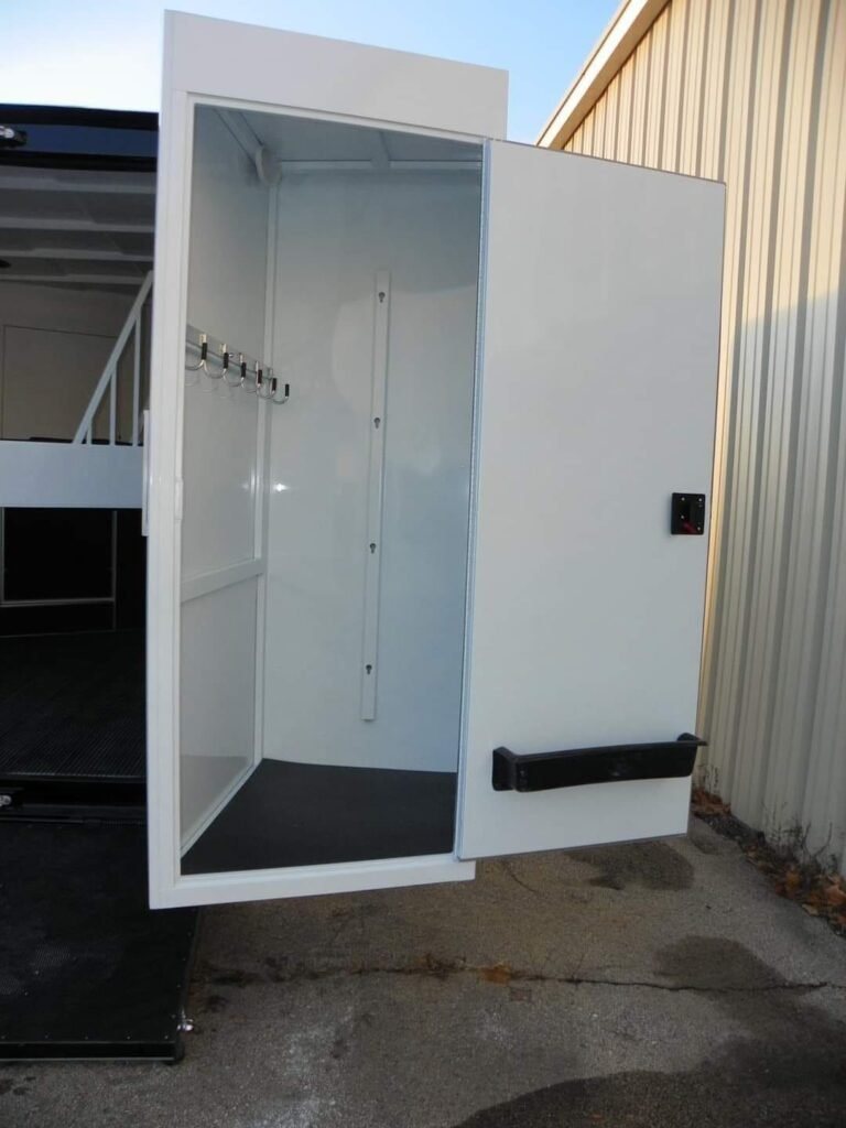 2022 Double D 2 Horse Bumper Pull – Reverse Slant – View of the dressing room door open showing hooks and floor