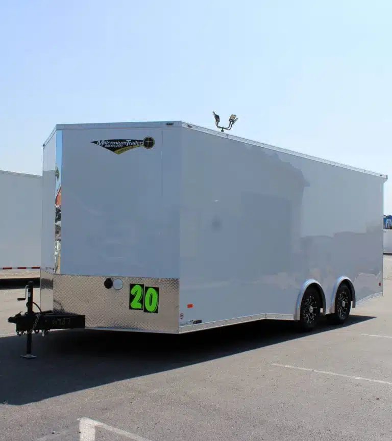 2025 Millennium Blaze 20 ft Enclosed Car Hauler – White – Front three-quarter view of a white enclosed car hauler trailer with black wheels