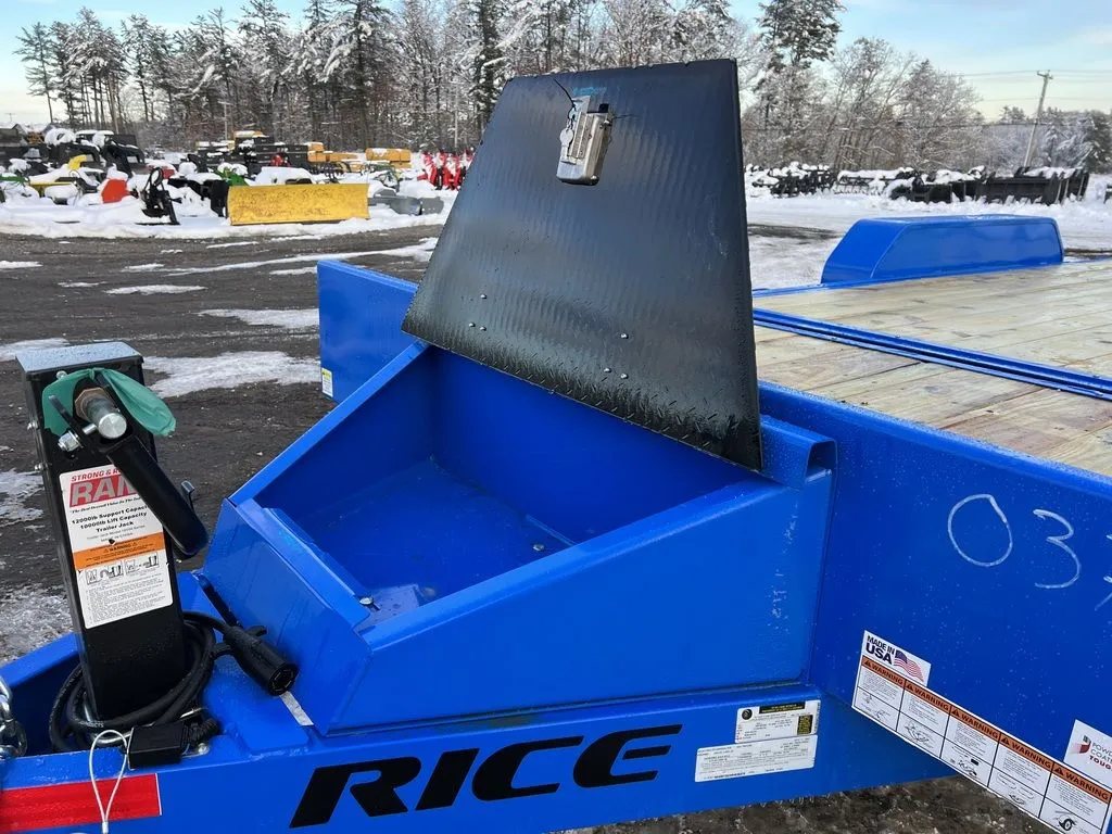 2024 Rice Trailers 20 ft Tilt Trailer – Spare Mount – An open view of the black diamond plate toolbox showing the interior compartment