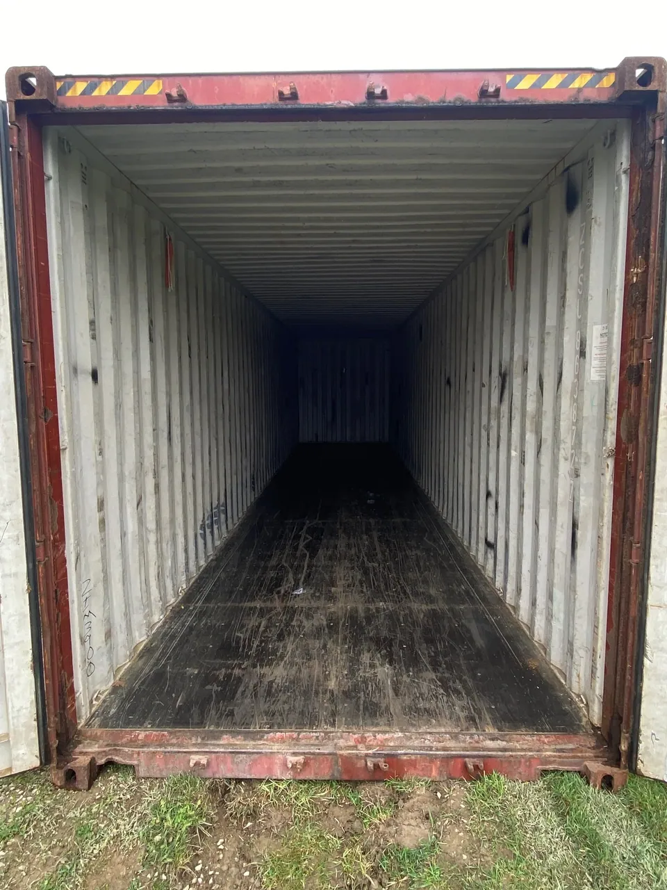 40ft High Cube Used Shipping Container – Lockable Cargo Doors – empty container interior with worn wooden floor and open doors