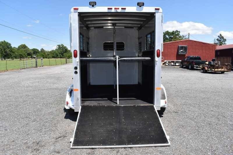2000 Sundowner 2 Horse Gooseneck Trailer – Dressing Room – The rear of the trailer with the ramp down showing the horse stalls
