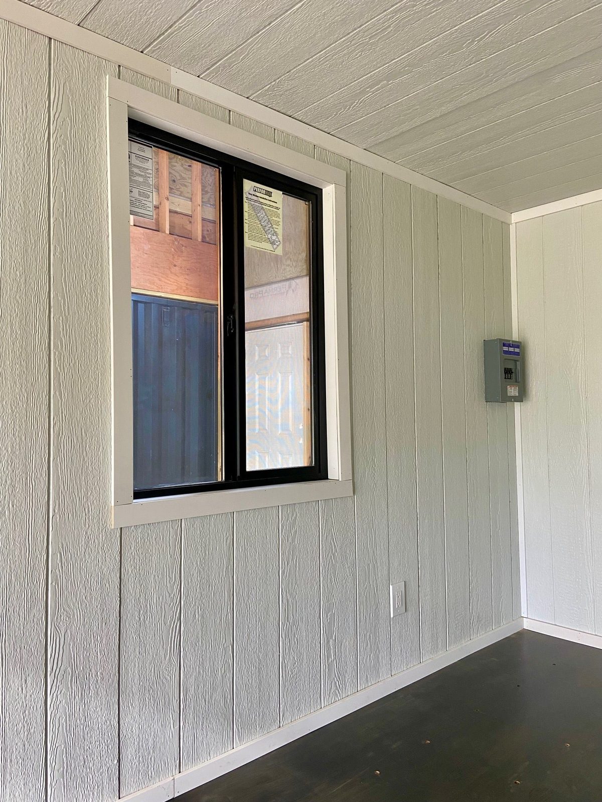 20ft Modular Container Office – LED Lighting, Two Windows – empty office interior with window and electrical panel