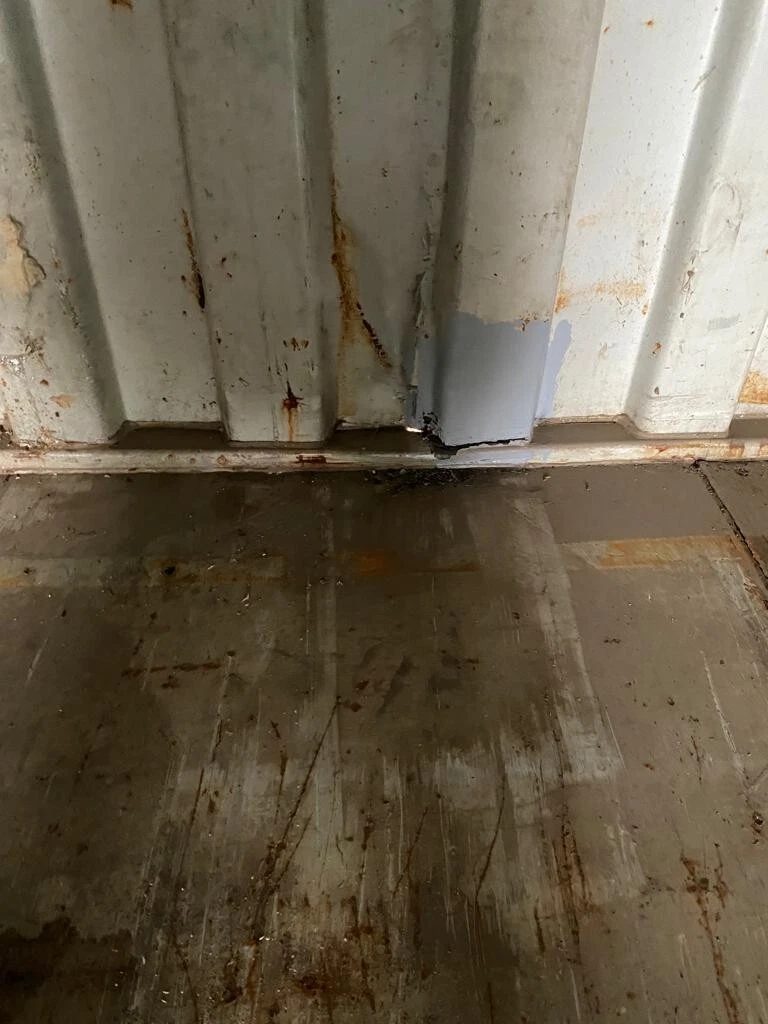 40ft Used Shipping Container – Standard Dry Storage – close-up of rusted interior wall and worn container floor