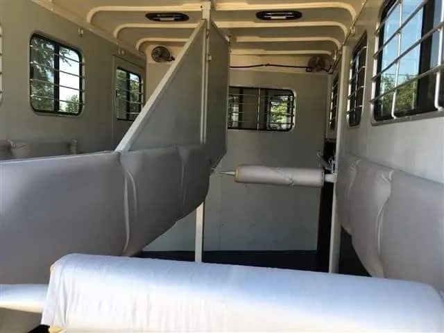 2007 Hawk 2 Horse Bumper Pull Trailer – Side Ramp – View looking through the interior of the horse trailer with padded dividers