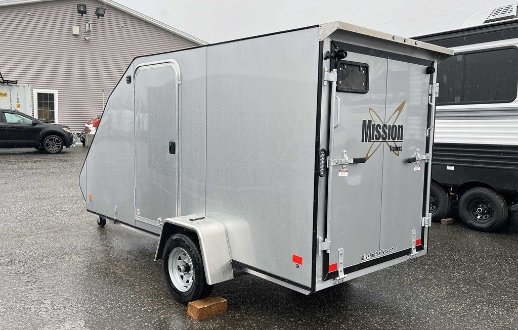 2024 Mission Trailers Crossover Trailer – Galvanized Package – Rear three-quarter view from the passenger side showing closed rear ramp