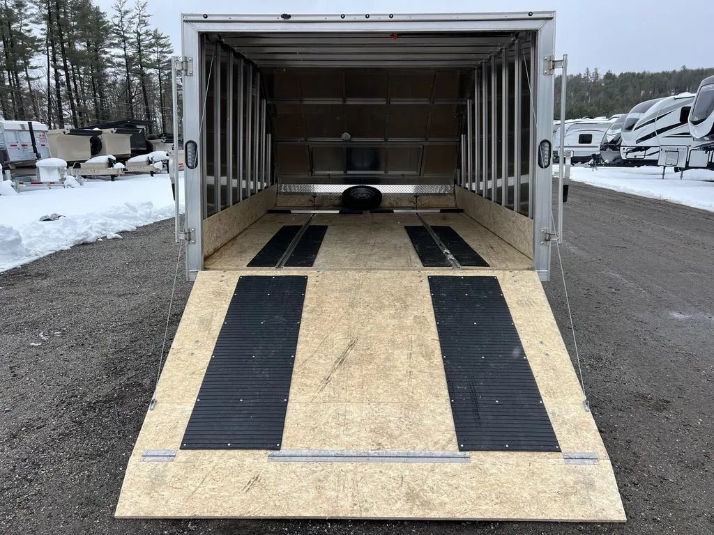 2022 High Country 12 ft Hybrid Trailer – Track Mats – View looking into the trailer from the ramp showing track mats on the floor