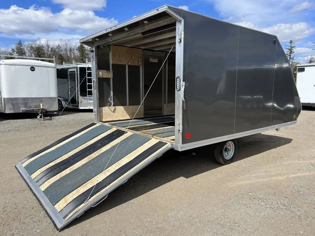 2023 Sno Pro 2-Place Snowmobile Trailer – Galvanized Package – Elevated view looking into the trailer with the rear ramp door extended