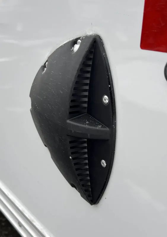 2024 E-Z Hauler 24 ft Trailer – Rear Canopy – Close-up of a black plastic flow-through vent on the trailer exterior wall