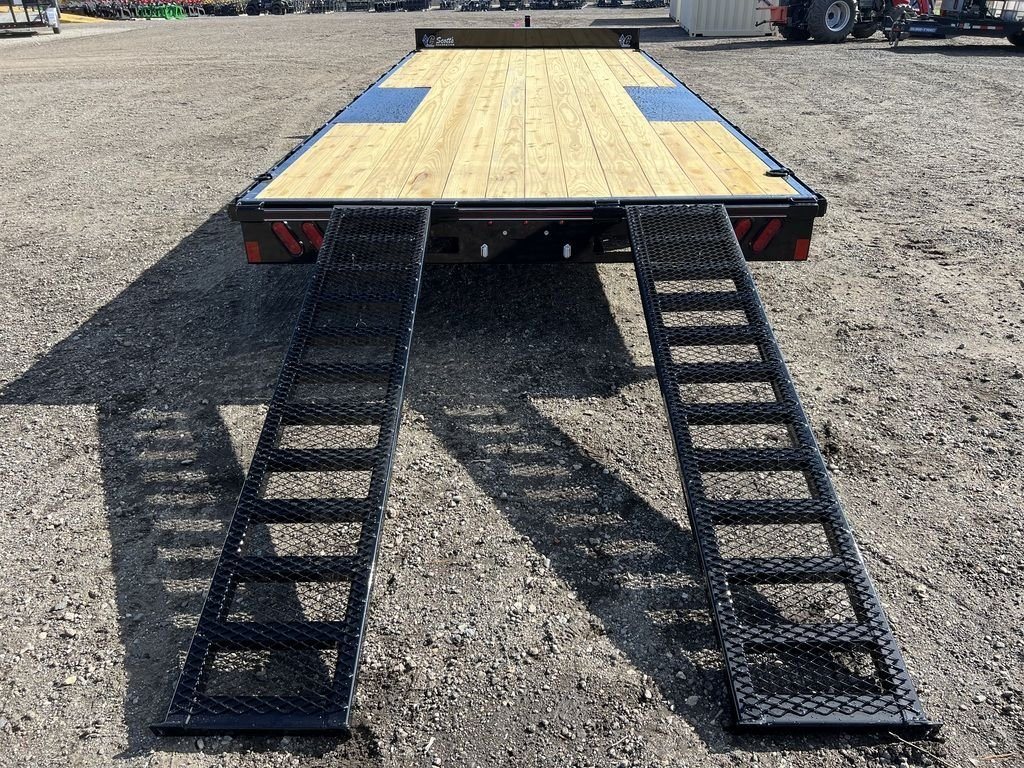 2024 Diamond C 20 ft Deckover – Slide-In Ramps – Direct rear view looking up the ramps onto the wood trailer deck