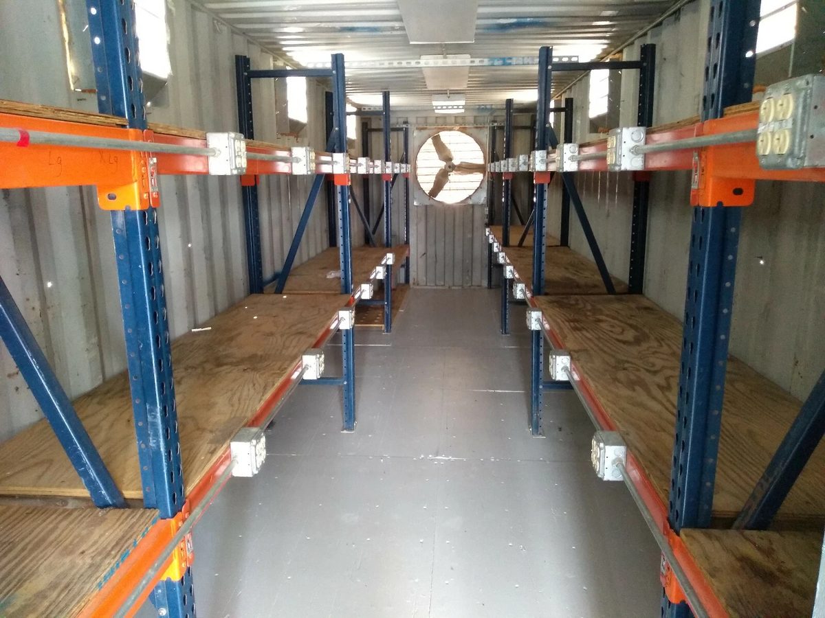 40ft High Cube Container Office – Storage Racking, Side Access – container storage interior with shelving, electrical outlets and ventilation fan