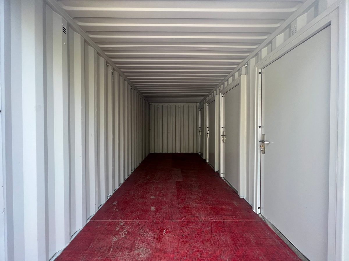 20ft New Shipping Container – Four-Door Storage Configuration – empty container interior with multiple side doors and red floor