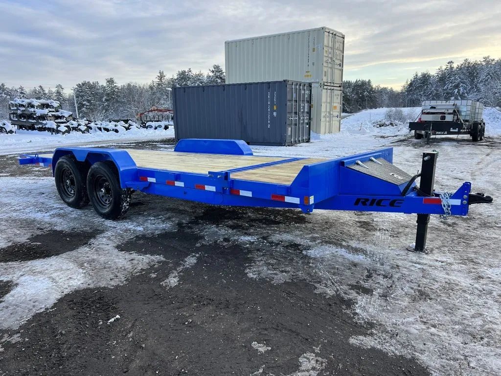 2024 Rice Trailers 20 ft Tilt Trailer – Spare Mount – Front three-quarter exterior view of the blue equipment trailer against a snowy background