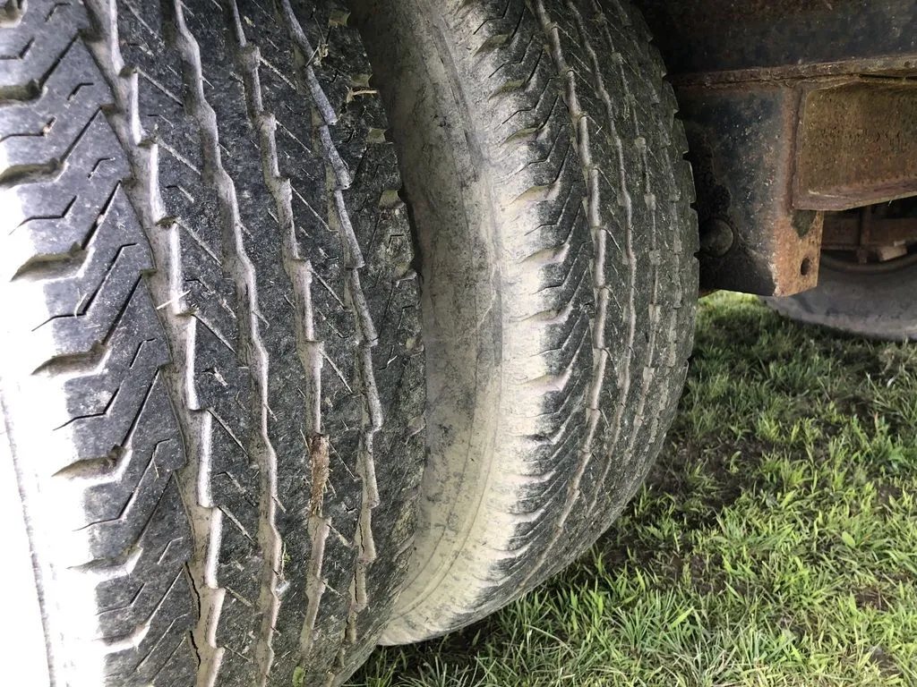 2002 Kaufman 40 ft Equipment Trailer – Toolbox – Close-up view of the tire tread on a dual wheel assembly