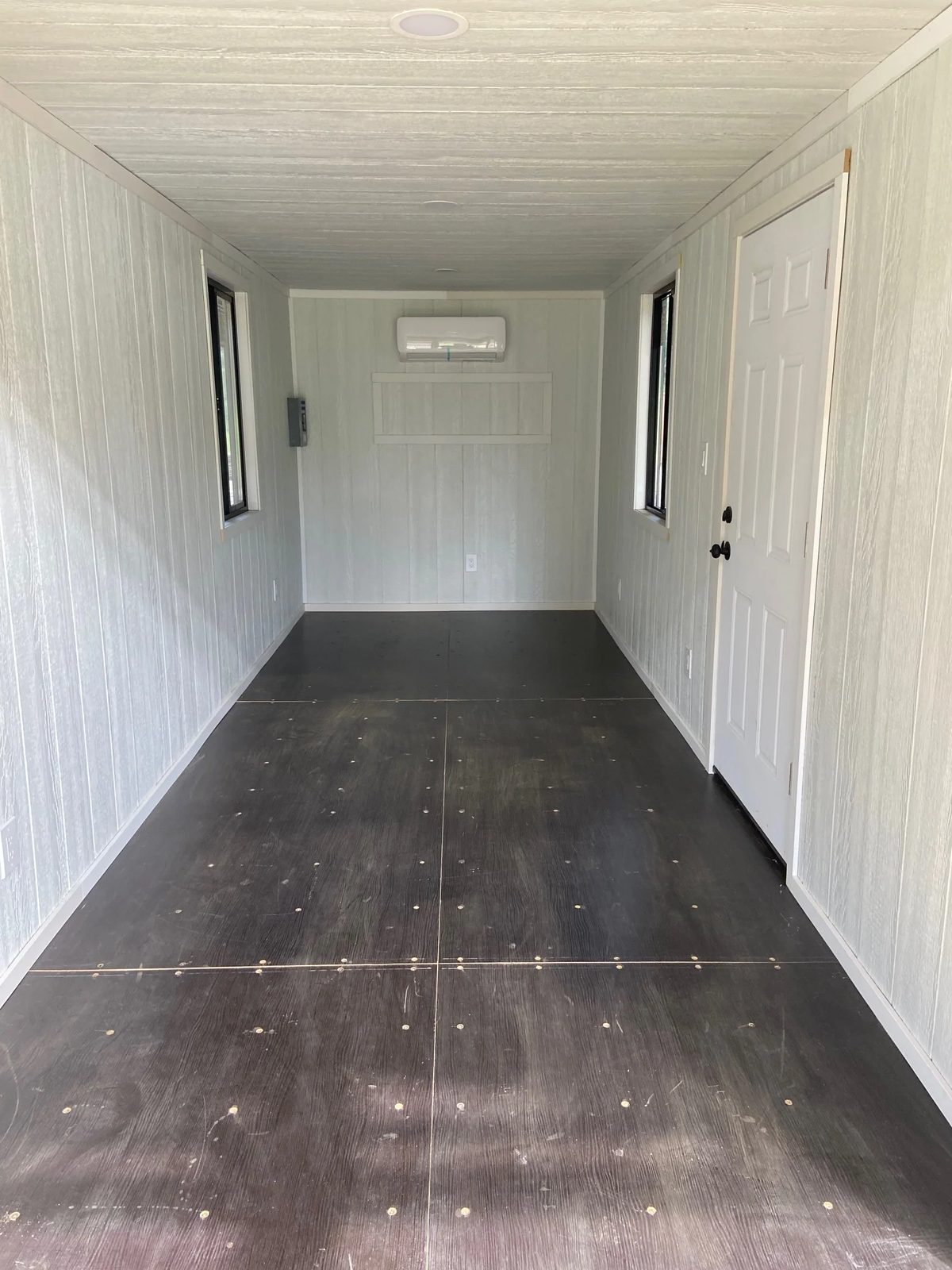 20ft Modular Container Office – LED Lighting, Two Windows – empty office interior with windows and wall mounted air conditioner