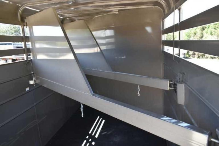 2017 CM 3HSLBP 3 Horse Trailer – Galvanneal, Dressing Room – Interior stall area showing the metal horse dividers in a slanted position