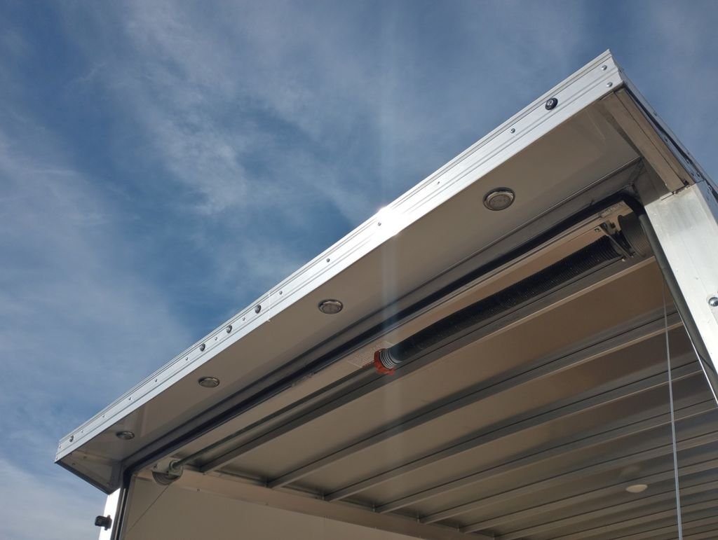2024 Mission Trailers 24 ft Deckover – Galvanized Package – Close-up of the exterior rear roof canopy with integrated LED loading lights