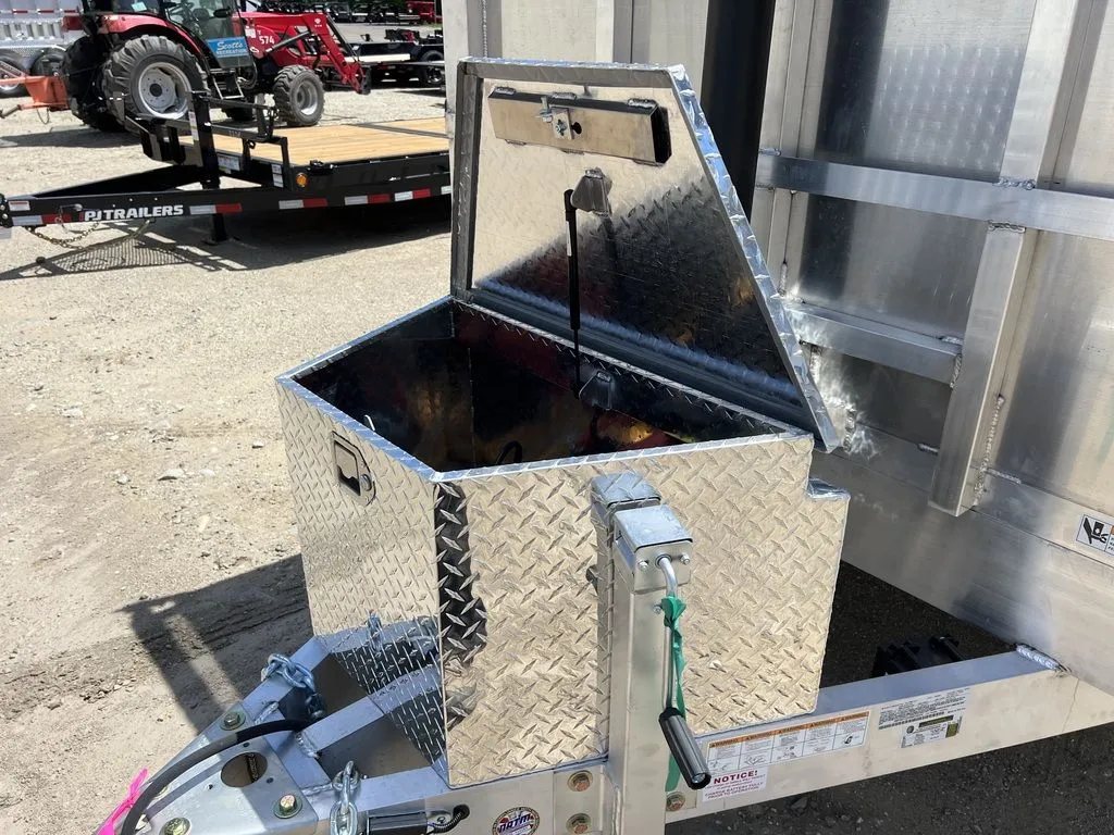 2024 Cargo Pro 12 ft Dump Trailer – Aluminum – Open diamond plate storage box mounted on the front of the trailer frame