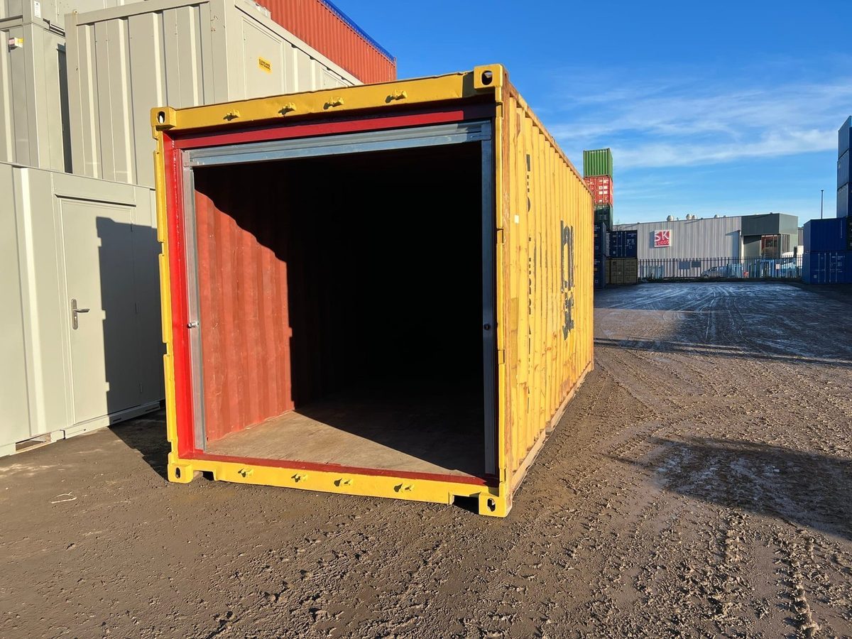 20ft Used Shipping Container – Roller Shutter Door – three-quarter exterior of yellow container with roller shutter open