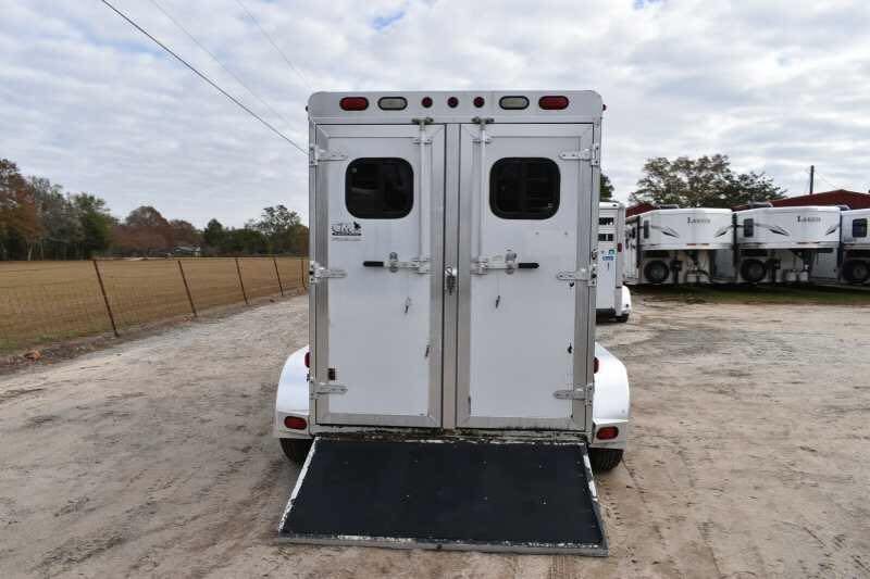 2001 CM Odyssey 2 Horse Trailer – Aluminum Floor – Rear view of the trailer showing closed double doors and a lowered ramp