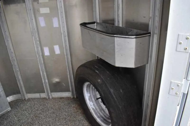 1995 Featherlite 2 Horse Trailer – Aluminum, Dressing Room – Spare tire and a metal storage bin mounted inside the front tack area