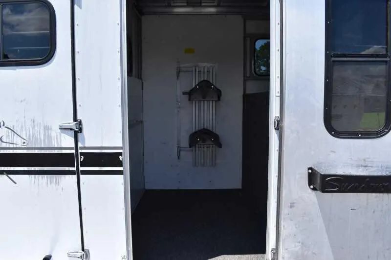 2000 Sundowner 2 Horse Gooseneck Trailer – Dressing Room – Interior view of the tack room area showing saddle racks