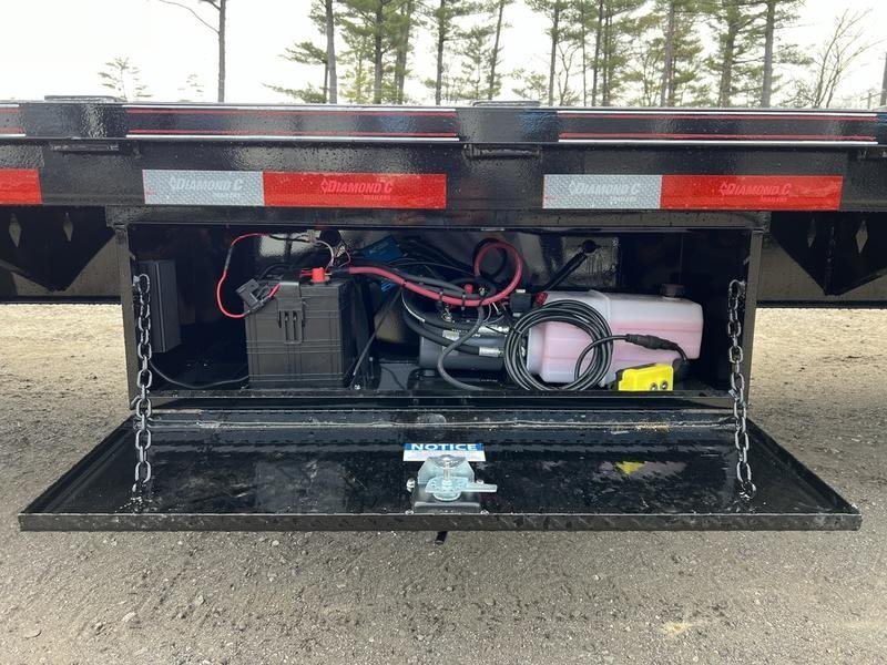 2024 Diamond C 35 ft Equipment Trailer – Auto Dovetail – Interior of a tool box containing the hydraulic pump and battery