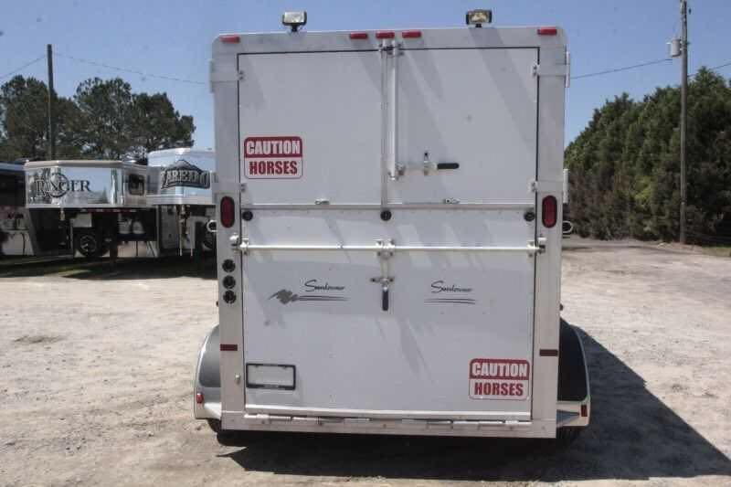 1999 Sundowner 20 ft Horse Trailer – Weekender – Rear view of closed horse trailer doors with caution horses stickers