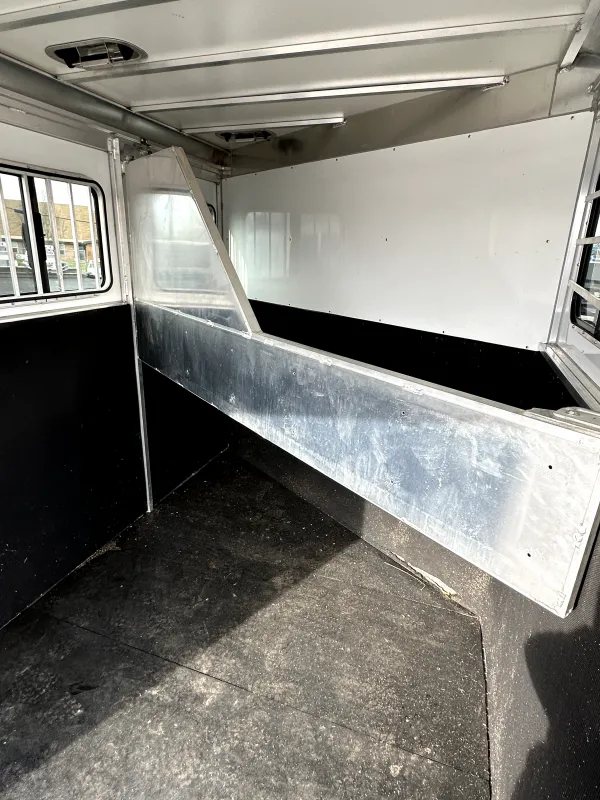 2021 Titan 2 Horse Bumper Pull Trailer – White, Slant Load – Interior horse stall area with metal divider and padded walls