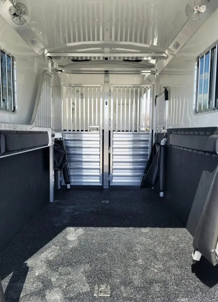 2023 4 Star 23 ft Horse Trailer – 2+1 Gooseneck – Wide angle view of the horse stall area with dark rubber flooring