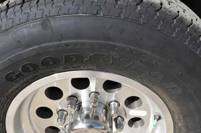 2018 Lakota 4 Horse Trailer – 2 ft Short Wall – Close up of a Goodyear tire mounted on an aluminum rim