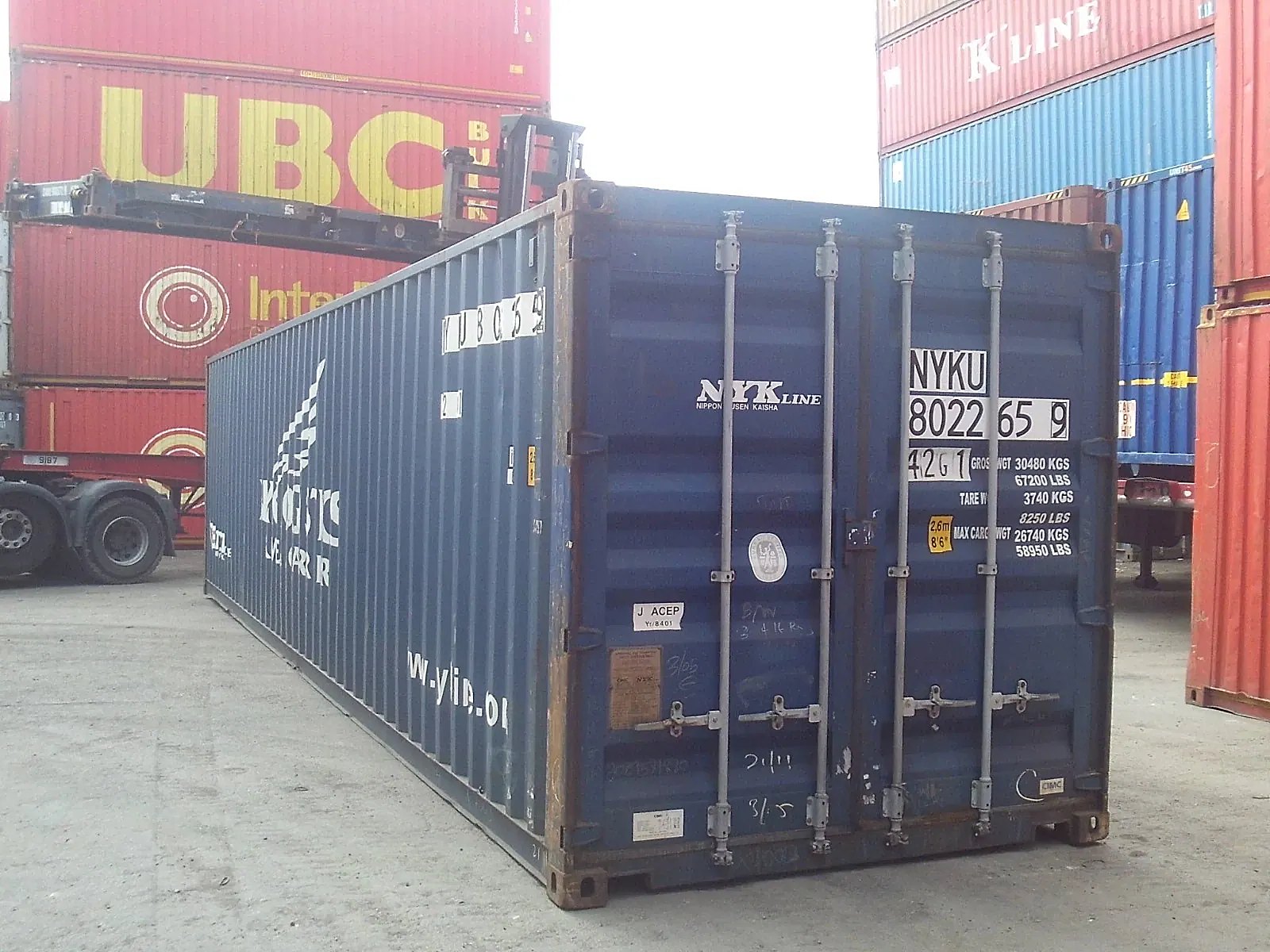 40ft Used Shipping Container – Standard Height, Double Doors – Blue shipping container with closed double doors and weathered sides in a container yard