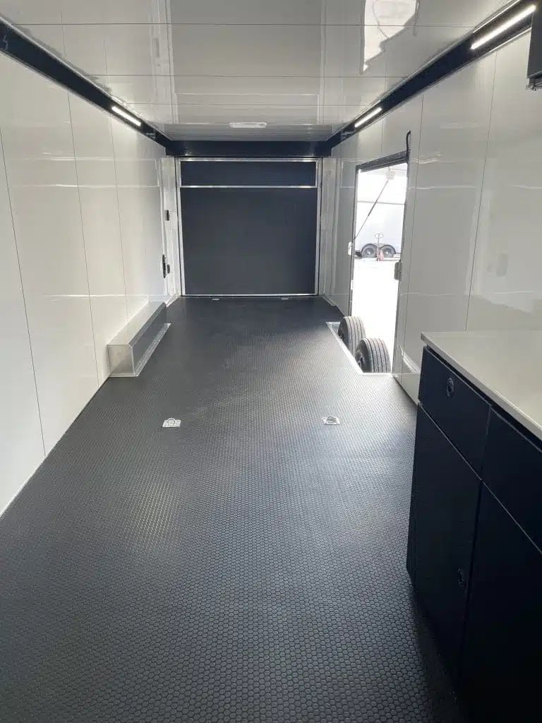 2026 ATC 44 ft Car Trailer – Aluminum Wheels – Wide interior shot of a trailer looking towards the open side door