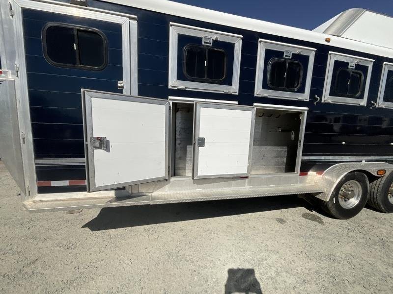 2005 Jamco 4 Horse Gooseneck Trailer – Blue, Air Suspension – Two open exterior storage compartment doors on the side