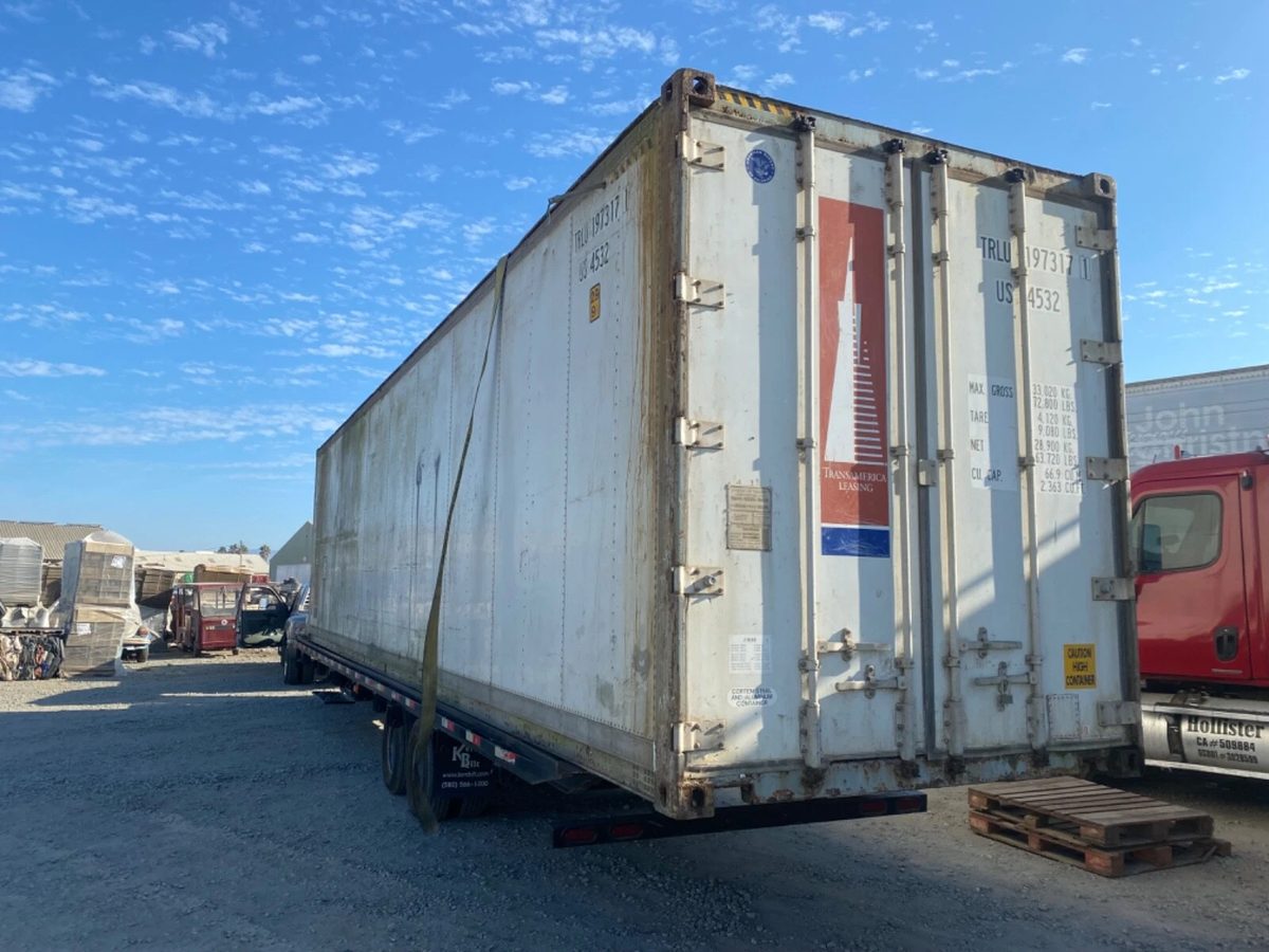 40ft Used Refrigerated Shipping Container – Custom Side Door – three-quarter exterior view of weathered refrigerated container with closed doors