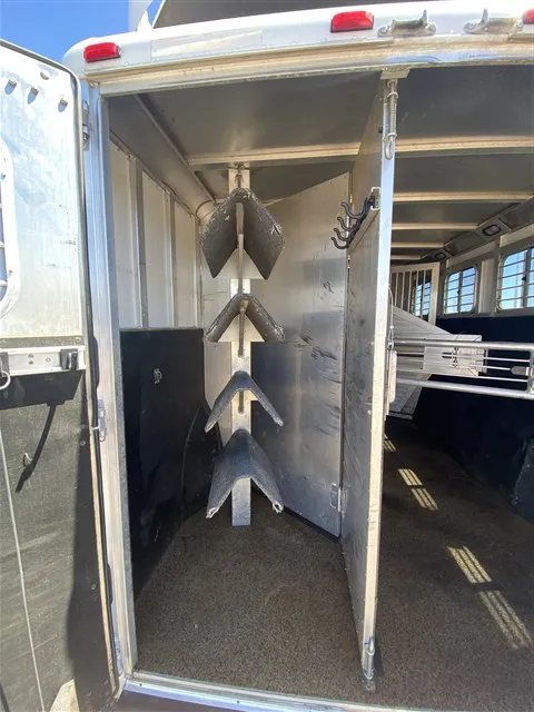 2000 Sooner 4 Horse Bumper Pull – Dressing Room, Awning – View of the swing-out saddle rack inside the rear horse area