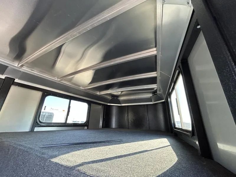 2022 Logan Coach Crossfire 3 Horse Trailer – Swing-Out Saddle Rack – Interior carpeted floor and walls of the gooseneck nose area