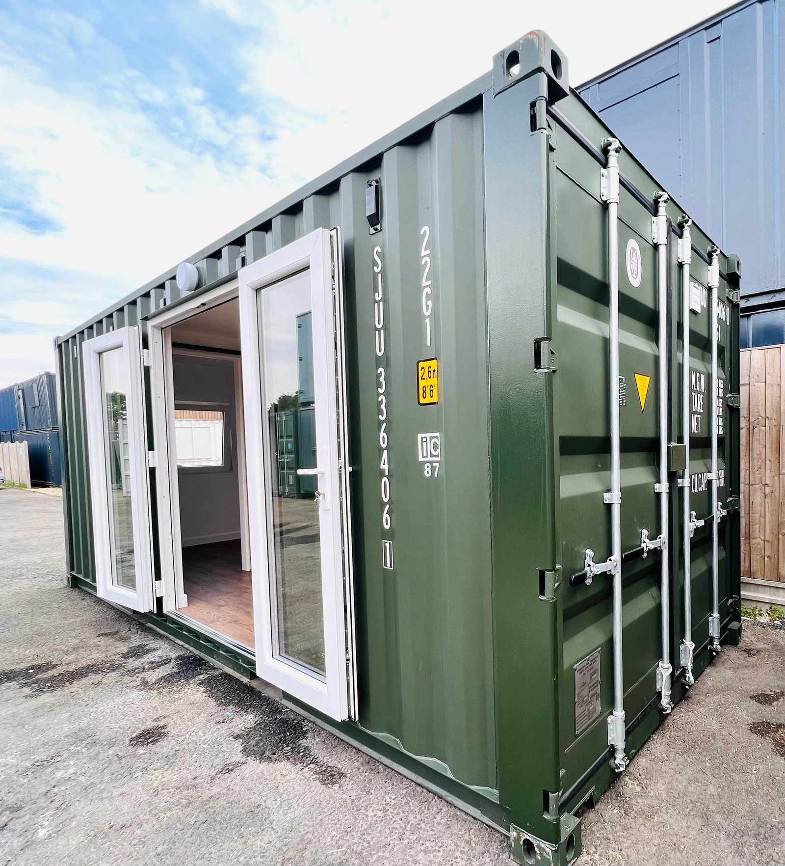 20ft Container Home – One Bed Box, 1 Bedroom – A refurbished 20x8 ft olive green shipping container converted into a modern one-bed box annex with secure glass doors