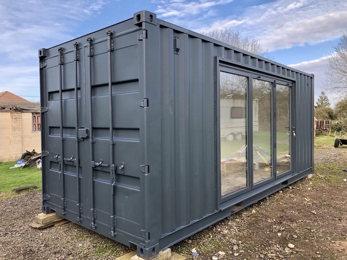 20ft Converted Container Office – Private Gym Configuration – Three-quarter exterior with closed cargo doors and glazed side entrance
