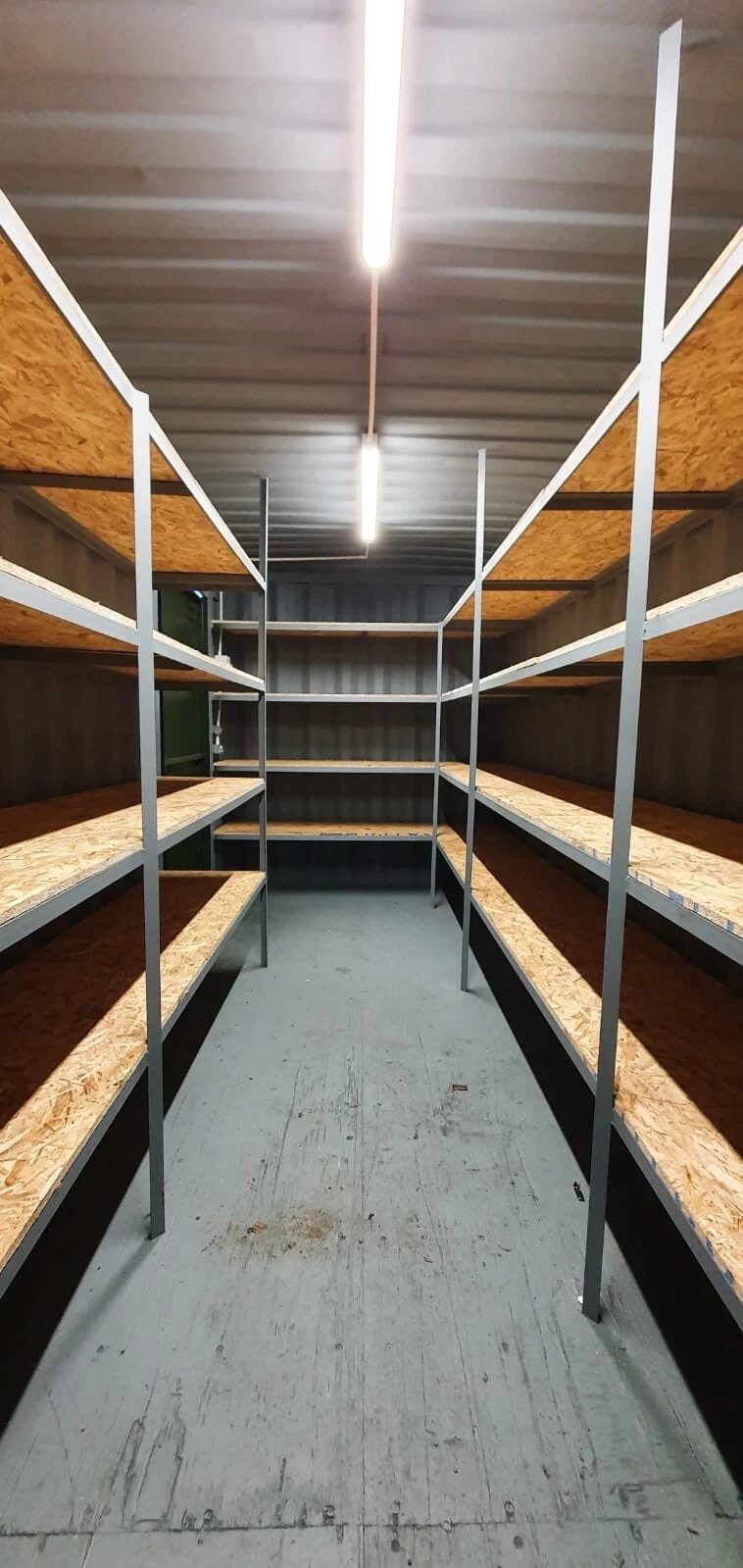 20ft High Cube Storage Container – Lighting and Shelving – container interior with wooden shelving and overhead strip lighting (6)